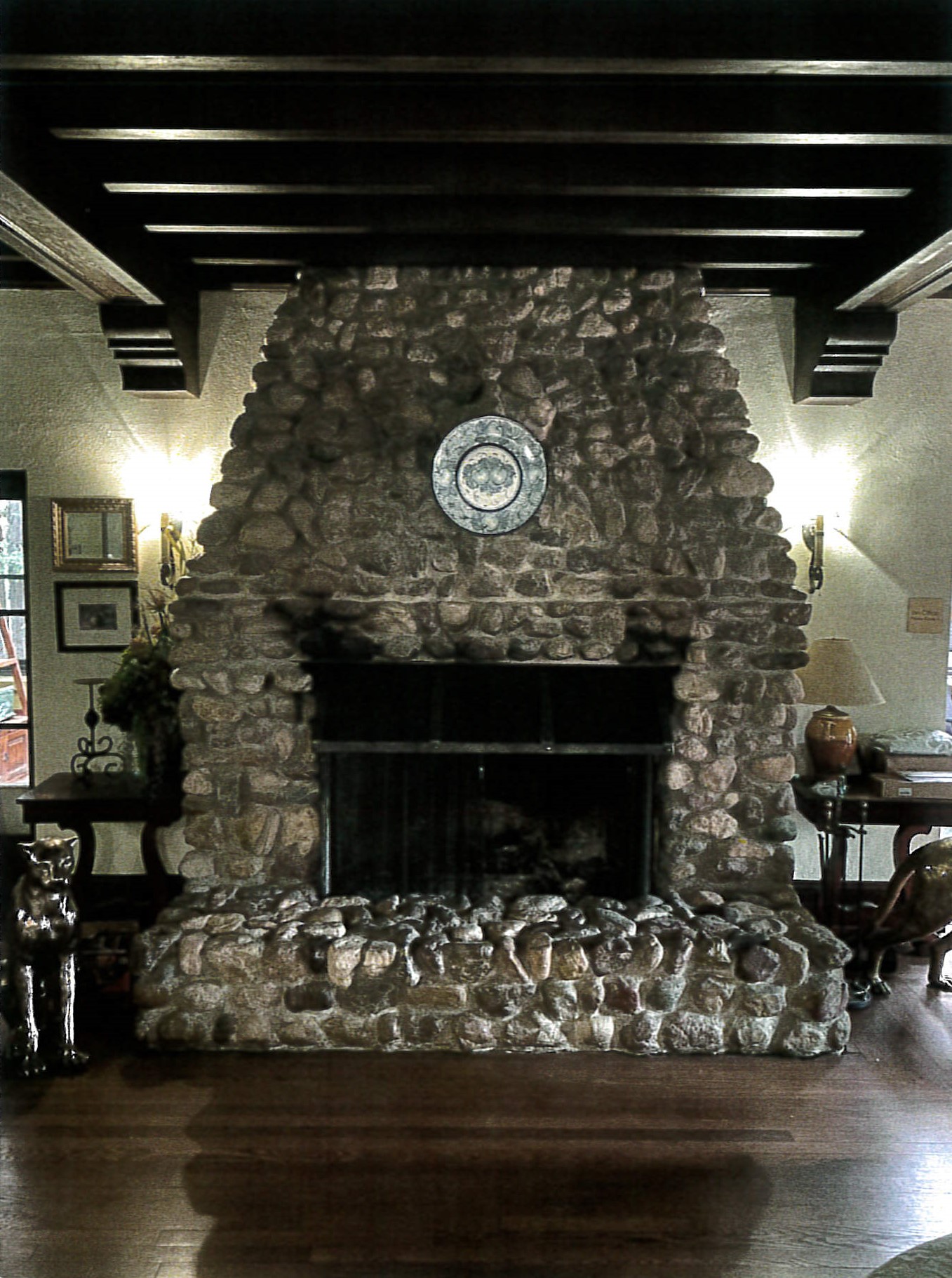 River rock fireplace in salon on mail level